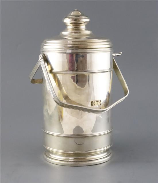 A 20th century Cartier sterling silver double handled ice bucket and cover, 30.5cm.